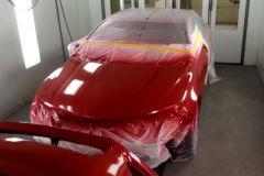 Red Car in Paint Booth